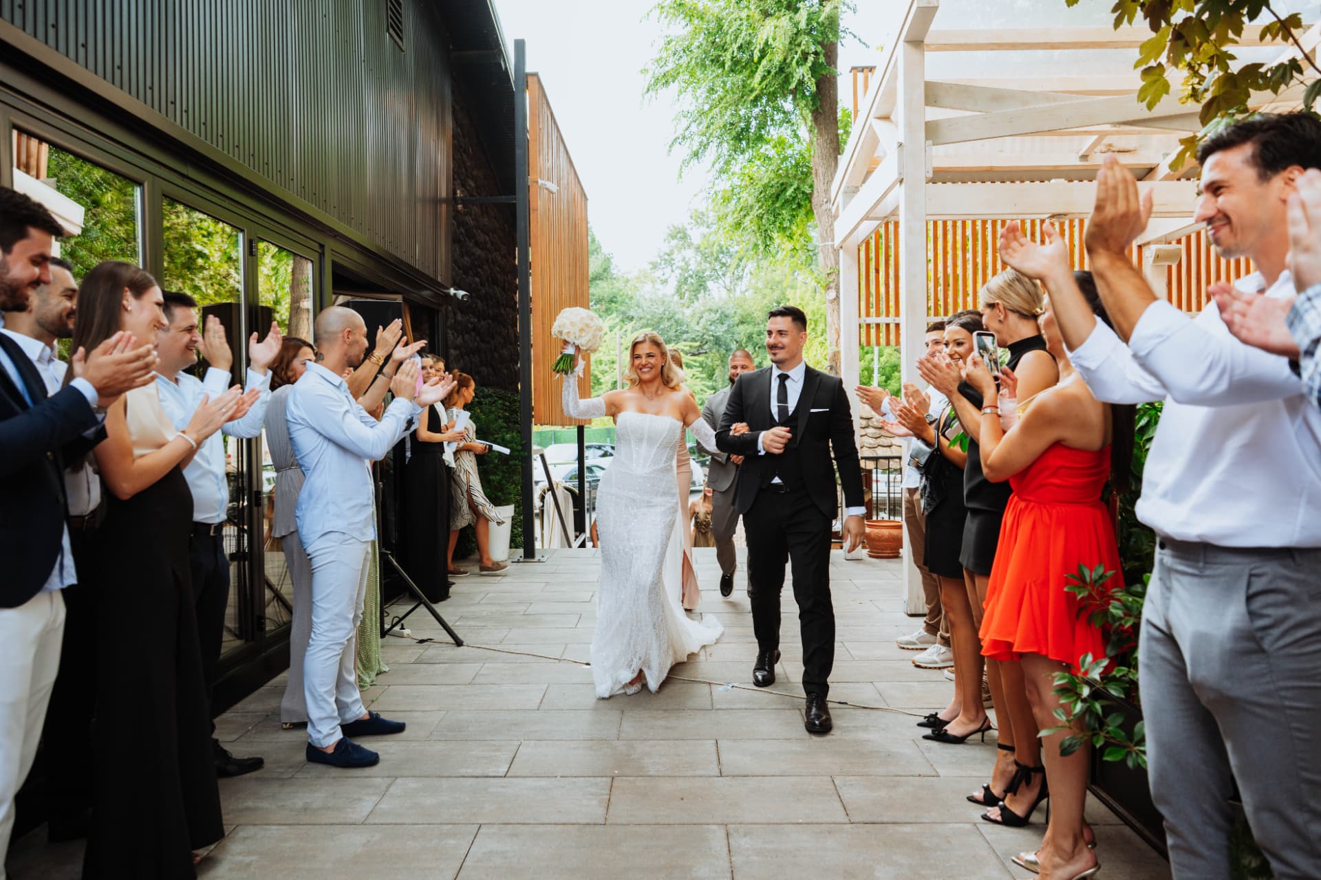 Wedding at Restaurant Suvenir, Novi Sad | Nemanja Potkonjak Bride and groom celebrating with wedding guests at Restaurant Suvenir in Novi Sad, Serbia – Nemanja Potkonjak Wedding Photography