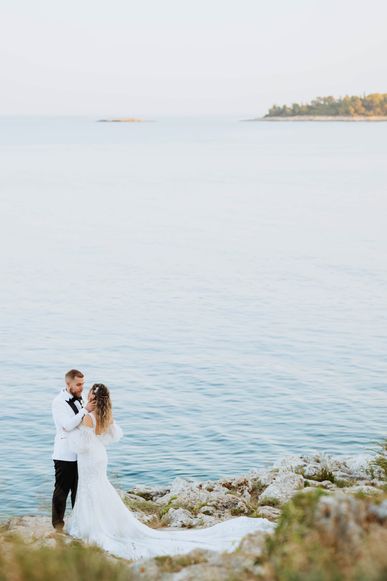 Bride and groom by the Adriatic Sea in Rovinj, Istria, Croatia – destination wedding photography by Nemanja Potkonjak